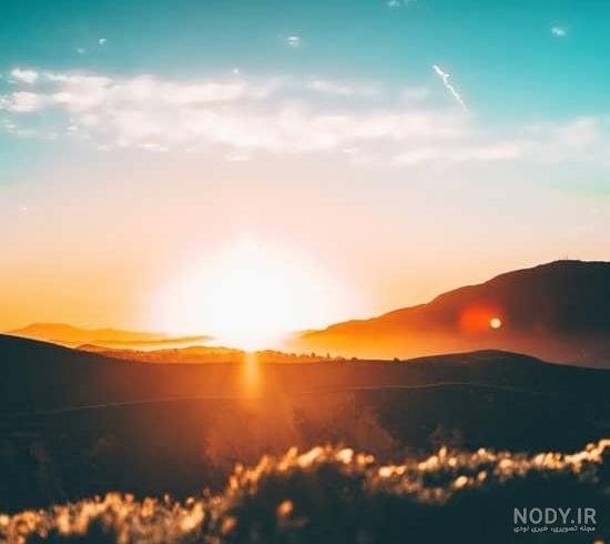  تصویر زمینه کوه برفی و غروب آفتاب