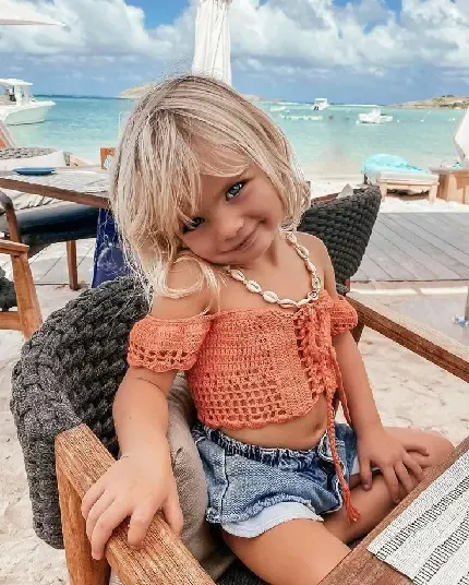  عکس دختر بچه چشم آبی با موهای طلایی