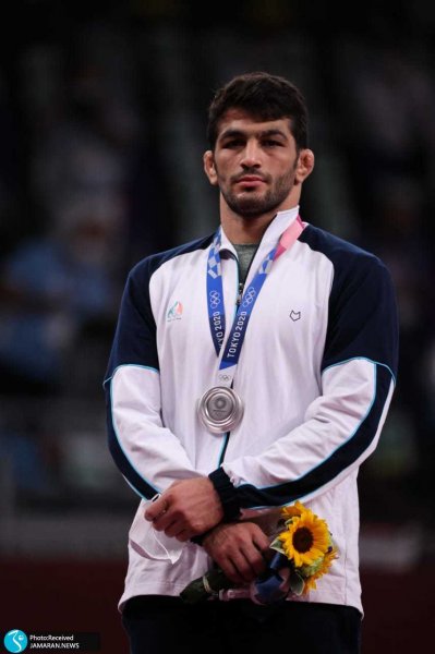 عکس حسن یزدانی با مدال طلا