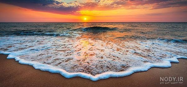 پس زمینه غروب زیبای آفتاب کنار ساحل با کیفیت اچ دی